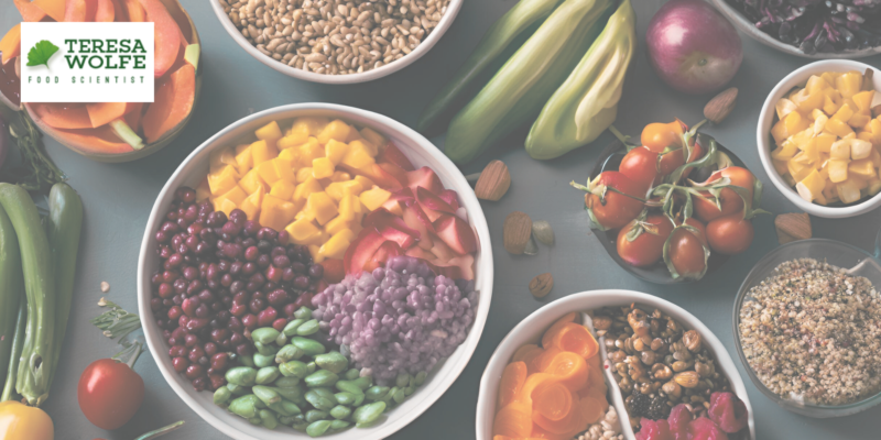 An image of a colorful, nourishing meal arranged with fresh vegetables, grains, and fruits, symbolizing high-vibration food choices.