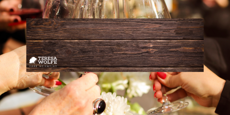 Navigating Holiday Temptations with Grace. Image of a festive holiday gathering, wine glasses raised in a celebration toast.