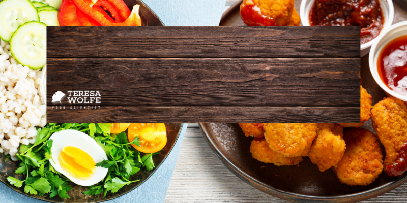A plate of healthy foods and a plate of fried chicken nuggets. The implied message is a reflection of economic influence on our food choices.